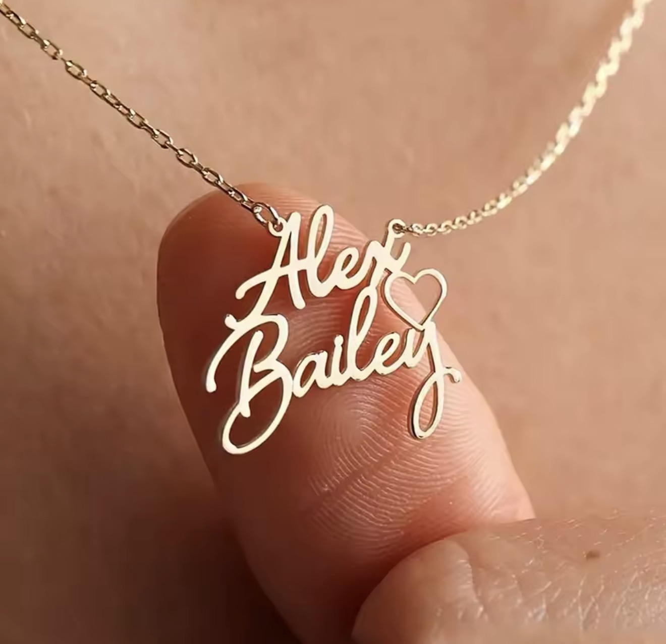 Gold double-name necklace with heart detail